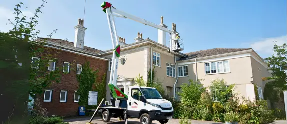 using our cherry picker on a commercial gutter cleaning job in Filwood, Sandy