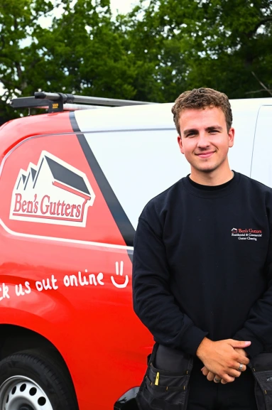 our gutter cleaner in Sandy standing by company vehicle